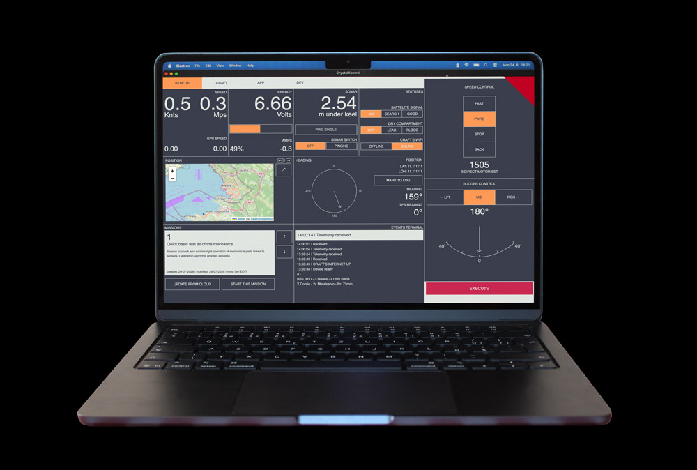 Laptop running Dolphin Control with telemetry, map, missions, and steering controls